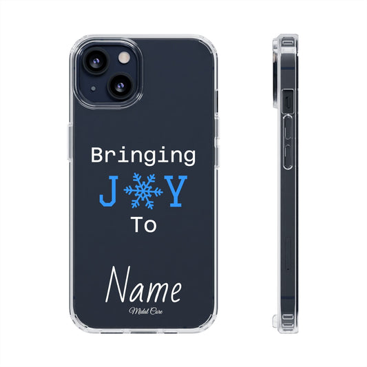 Personalized Christmas clear phone case with 'Bringing J❄️Y To Name' snowflake design on iPhone